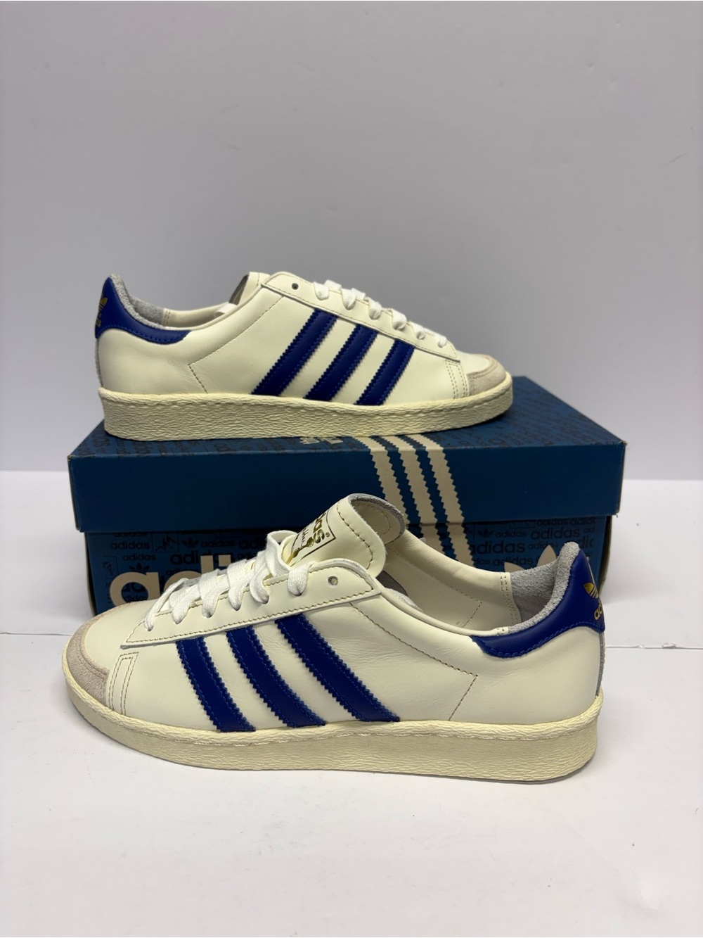 adidas Men’s White and Blue Low-Top Sneakers